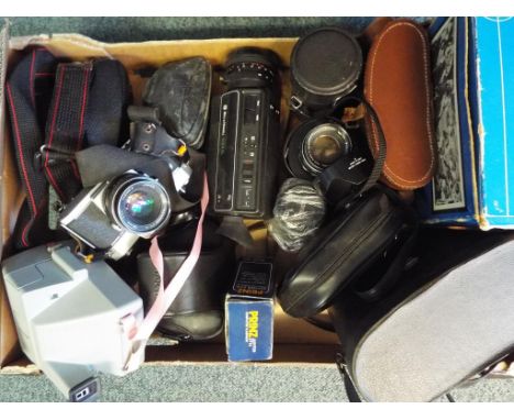 A good lot to include 4 pairs of binoculars, 4 camera lenses, 7 vintage cameras to include, Polaroid, Olympus, Konica, Prakti