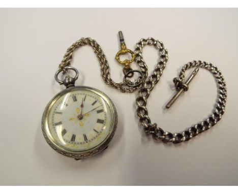 A lady's silver cased, key wind pocket watch stamped 0.935, Roman numerals on a white dial, with hallmarked silver T-bar, cha
