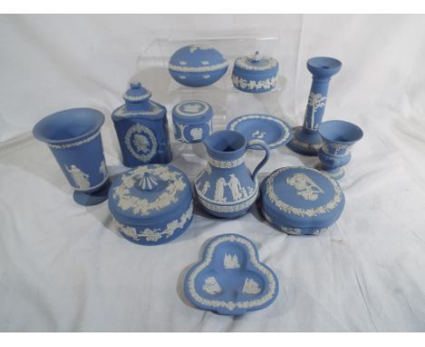 Wedgwood Jasper Ware - a collection of twelve ornamental ceramic pieces finished in powder blue to include, a candlestick, li