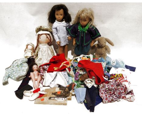 Two Sasha dolls&nbsp;and assorted dolls clothing&nbsp;Condition ReportBoth have some light surface scratches/marks and accret