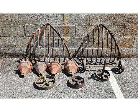 Set of four vintage cast iron ogee-shaped drain pipe hoppers, two hay baskets, various cast iron wheels&nbsp;and four cast ir