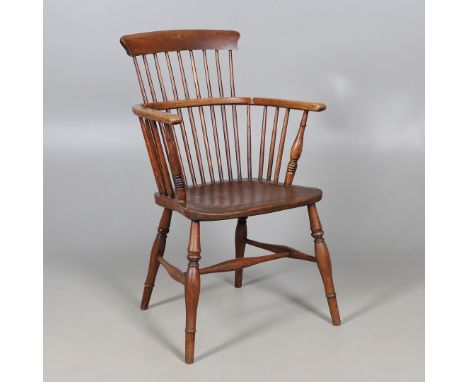 AN EARLY 19TH CENTURY ELM SEATED COMB BACK WINDSOR CHAIR. AN EARLY 19TH CENTURY ELM SEATED COMB BACK WINDSOR CHAIR. the dishe