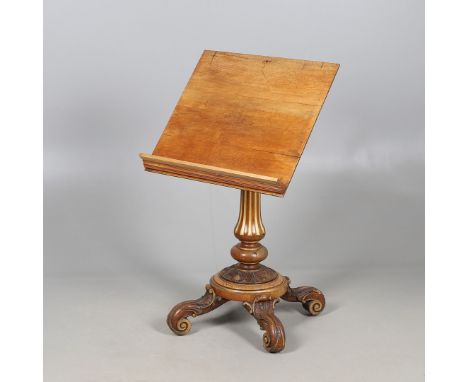 A VICTORIAN CARVED WALNUT AND PARCEL GILT READING STAND. A VICTORIAN CARVED WALNUT AND PARCEL GILT READING STAND. Circa 1860,