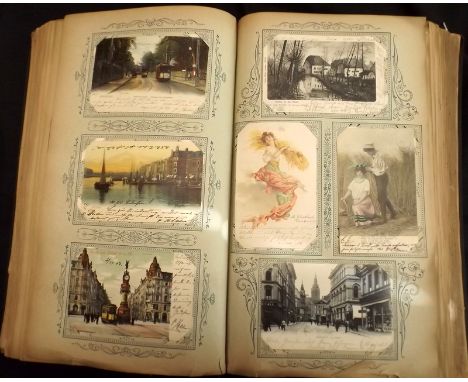 A large Edwardian album containing five hundred plus postcards mostly German and mainly used including Gruss Aus, shipping, L