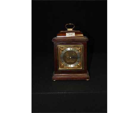 Elliot of London Walnut Cased Carriage Clock, on brass bun feet, retailed by Harrods London