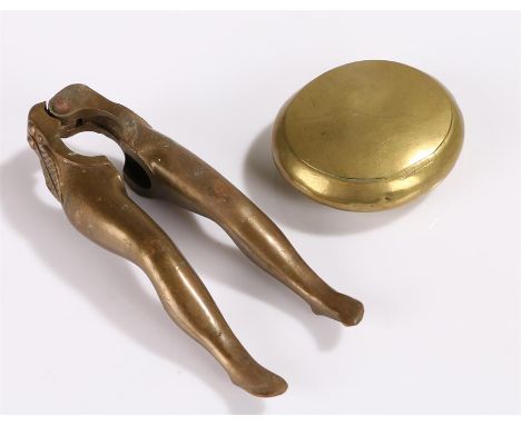 Pair of novelty nut crackers, in the form of a pair of ladies legs, together with a brass snuff box, (2)