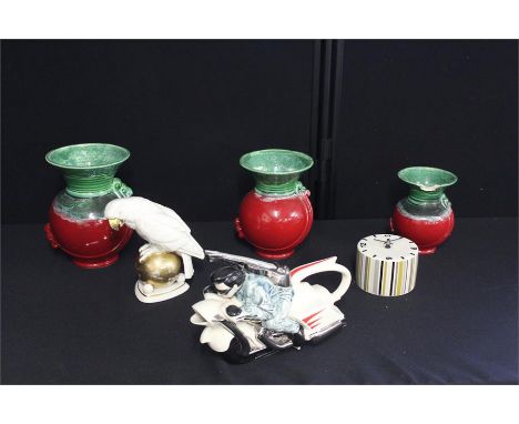 An ornamental rock and roll biker dish, together with three vases, a china parrot and a ceramic clock, (6)