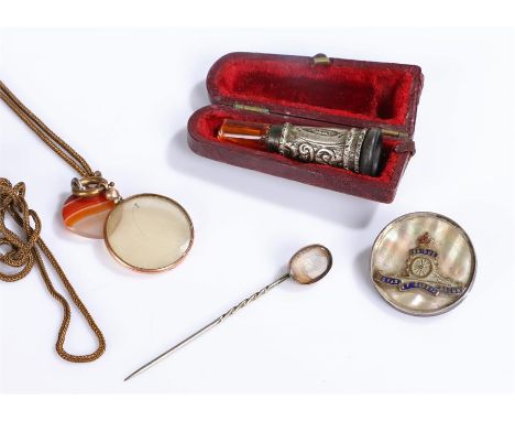 Mixed items, to include a cased silver cigarette holder, a artillery badge, a chain with agate heart and glass, together with