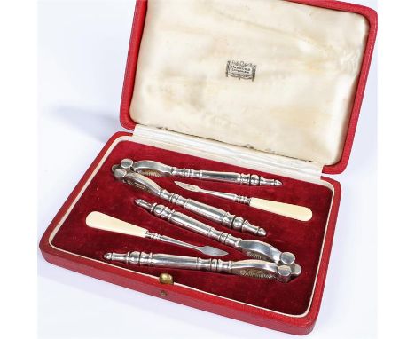 Harrods plated boxed nut cracker set, with two nut crackers and two picks, Harrods cased