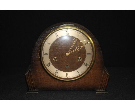 Smiths oak cased mantel clock, the chapter rings with Roman numerals and pierced hands, 28cm wide