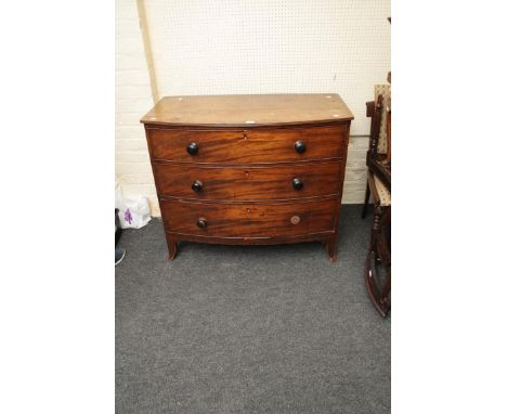 A Regency mahogany three drawer bow front commode chest, with splayed feet