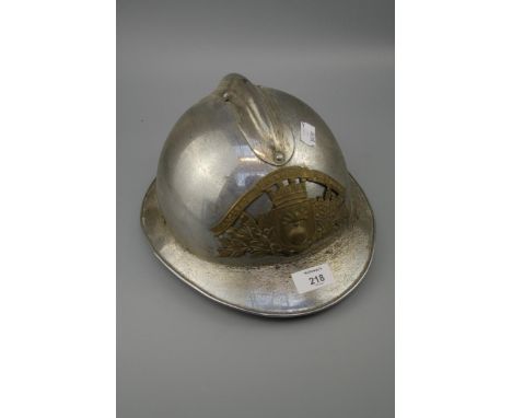 A French (1933 Pattern) nickel plated fireman's helmet with pierced and embossed front plate