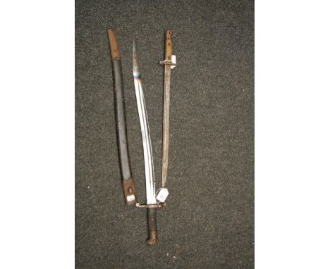 A 19th century Yatagan type sword bayonet with curved blade and leather scabbard, together with  Remington type bayonet