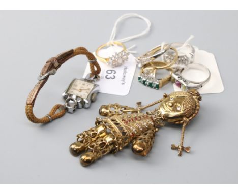 A single stone 15ct gold ring, five further rings, a silver gilt articulated doll pendant and a lady's Art Deco wristwatch