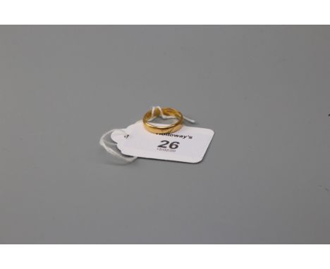 A wedding band, marked '22ct', polished 'D' profile Ring size O, 4.1g