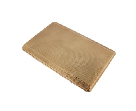 A 9ct gold cigarette case, with engine turned decoration and invisible slide opening. 178g.