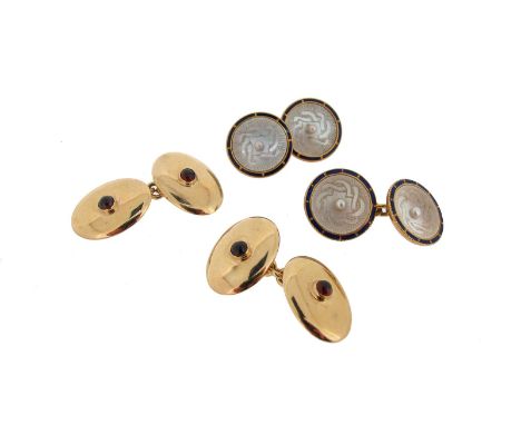 A pair of gold dress cufflinks, each mounted with a circular engine turned shell disc centred with a seed pearl and with blue