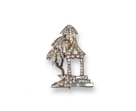 A diamond set pagoda brooch, the realistically formed pagoda is millegrain-set with circular and baguette-shaped diamonds. Wi
