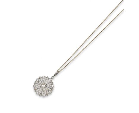 An Edwardian diamond and pearl swirling circular pendant, centred with a button-shaped pearl and alternately-set with larger 