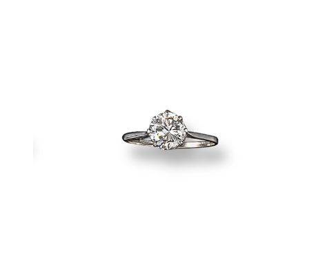 A diamond solitaire ring, the round brilliant-cut diamond weighs approximately 1.50 carats and is set in platinum and white g