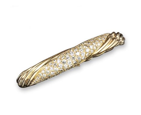 The property of an Aristocratic Lady.   A diamond-set gold hinged bangle, the centre section pave-set with round brilliant-cu