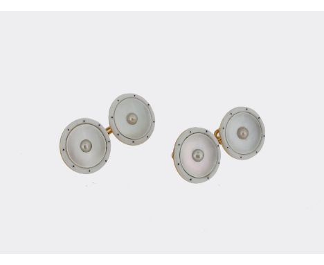 A pair of gold dress cufflinks, each link centred with a circular shell disc centred with a seed pearl, within a white enamel