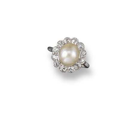 A natural pearl and diamond ring, the oval button-shaped pearl is set within a surround of old cushion-cut diamonds in platin