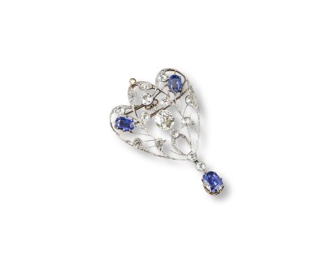 An early 20th century sapphire and diamond brooch pendant, millegrain-set with circular cut diamonds and two oval-shaped sapp