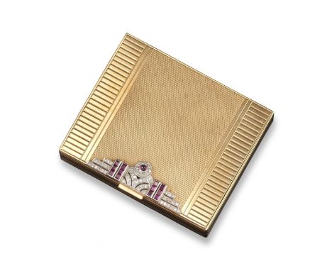 An early 20th century gold compact, with engine turned decoration, the opening section applied with sapphires and rubies in a