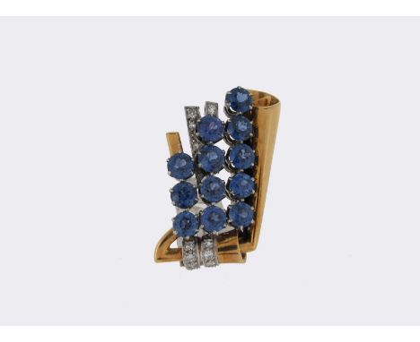 A sapphire and diamond-set gold and platinum scroll brooch, C1940, numbered 7166. 3cm high.