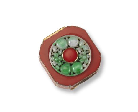 A small French Art Deco gold square-form compact. The hinged cover applied with a circular jade disc pierced and carved with 