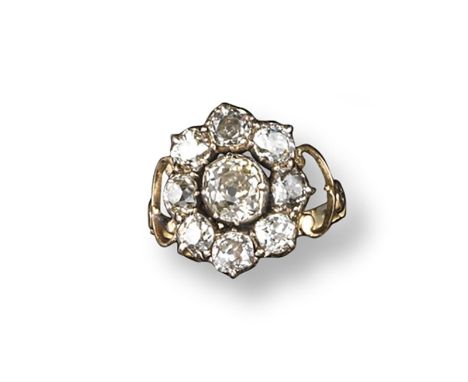 A George III diamond cluster ring, the old cushion-shaped diamond is set within a surround of eight smaller old cushion-shape