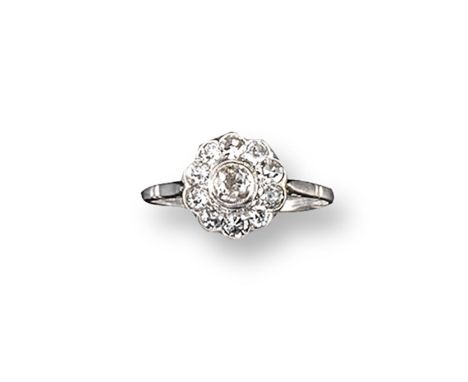 A diamond cluster ring, the old cushion-shaped diamond is set within a surround of smaller diamonds in platinum. Size N.