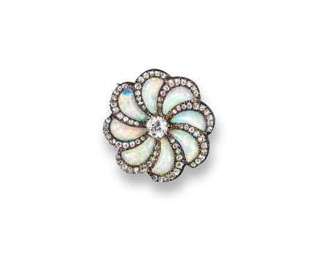 An early 20th century opal and diamond flower-head brooch, centred with an old circular-cut diamond within scrolling sections