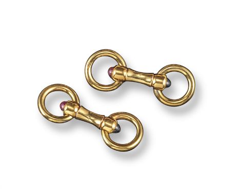 A pair of yellow gold cufflinks, with cabochon ruby and cabochon sapphire terminals, each with two swivel circular ring links