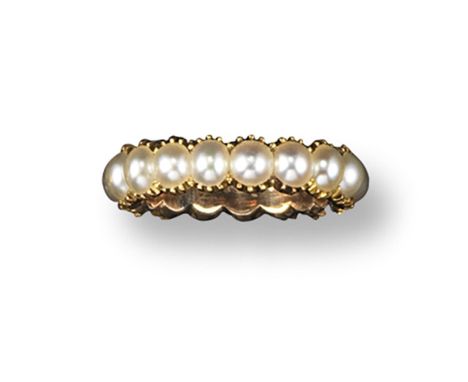 A late George III full circle eternity ring, set with half pearls in gold. Size K.