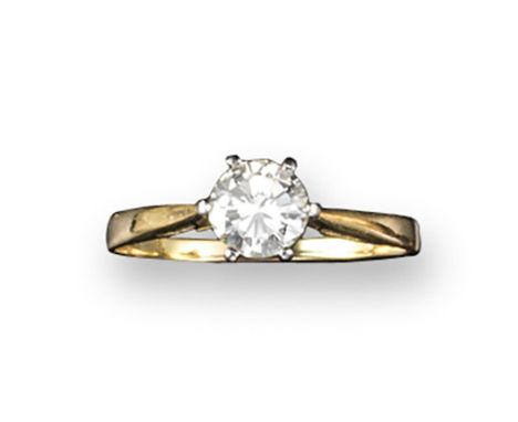 A diamond solitaire ring, the round brilliant-cut diamond weighs approximately 0.75 carats and is set in platinum and yellow 