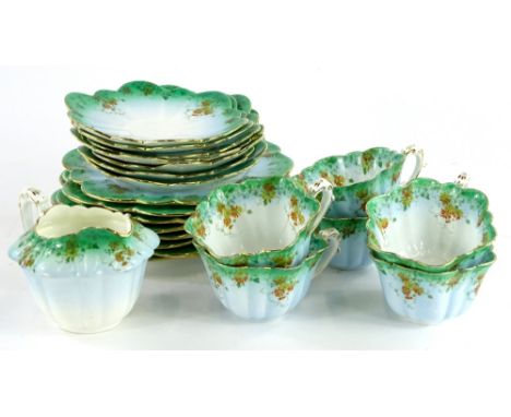 A Foley China part tea service, with shaped cups, saucers, etc., in blue and green embellished with yellow and orange flowers