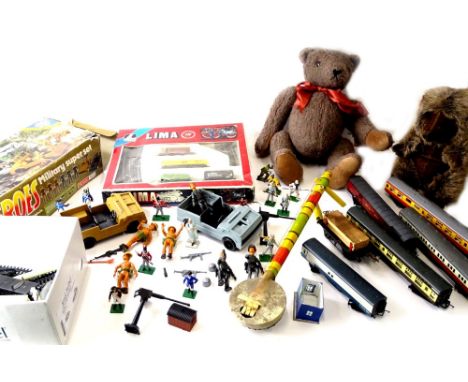 A large quantity of toys, to include some model railway, Heroes Military Super Set, Teddy bear, small Lima train set, etc.