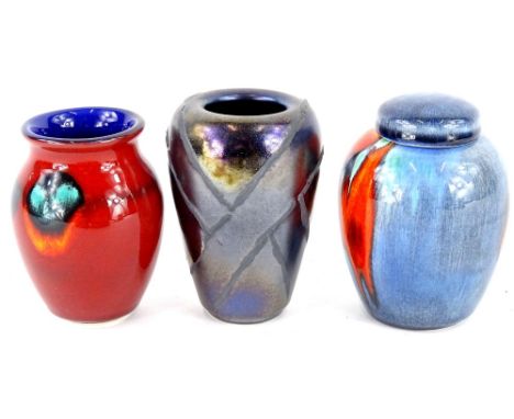 Three Poole pottery vases, to include black lustre glaze example and a ginger jar, each in original box, the largest 10cm hig