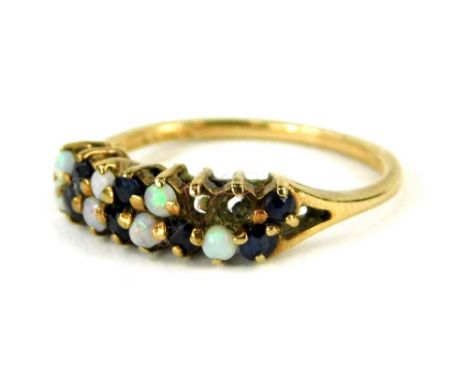 A 9ct gold dress ring, set with blue stones and imitation opals (some missing), in claw setting, ring size K, misshapen, 1.8g