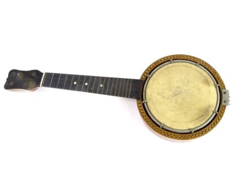An early 20thC ukulele, with mother of pearl and ebony stringing, 55cm long.