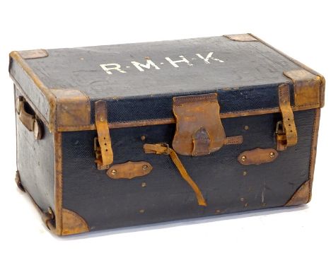 A canvas and brown leather trunk, the lid bearing the initials R.M.H.K. Provenance: The Estate of Miss Rachel Monson.