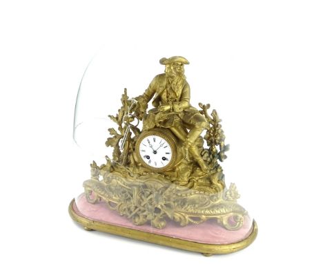 A late 19thC French gilt metal figural mantel clock, the enamel dial with Roman numerals, on a shaped base, decorated with ho