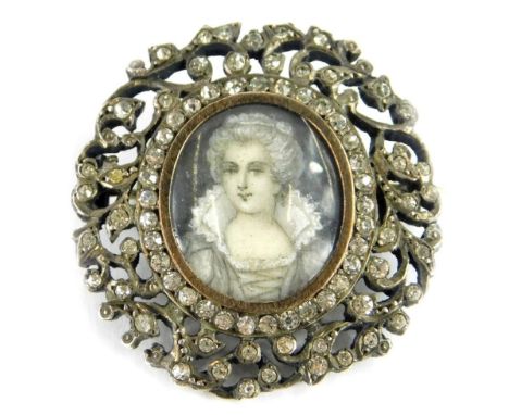 A Victorian paste stone set portrait brooch, with central oval portrait panel of a lady in Victorian dress, with a silver gil