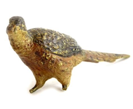 An early 20thC bronze model of a pheasant, in the manner of Bergman, (AF), 12cm long.