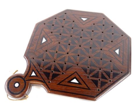 An early 19thC ebony and mother of pearl inlaid cribbage board, of octagonal form, engraved to the reverse "Joseph Proctor, m
