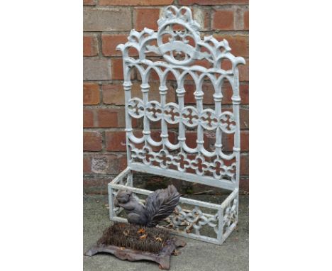 A Victorian style wall mounted shelf or compartment, decorated with gothic, etc., 68cm x 40cm, and a cast iron squirrel mount