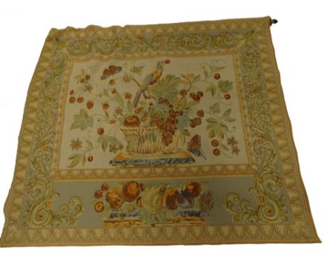 A continental style machine woven tapestry, decorated with a vase of flowers, fruit within geometric borders, etc.