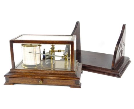 An early 20thC brass barograph, in an oak case with drawer, on bracket feet, 38cm wide and a carved wooden bracket. Provenanc